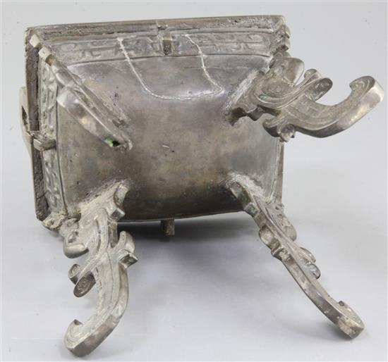 A Chinese archaic bronze quadruped ritual food vessel, Fangding, early Western Zhou dynasty, 22.7cm high, 17.5cm wide, repairs and lack